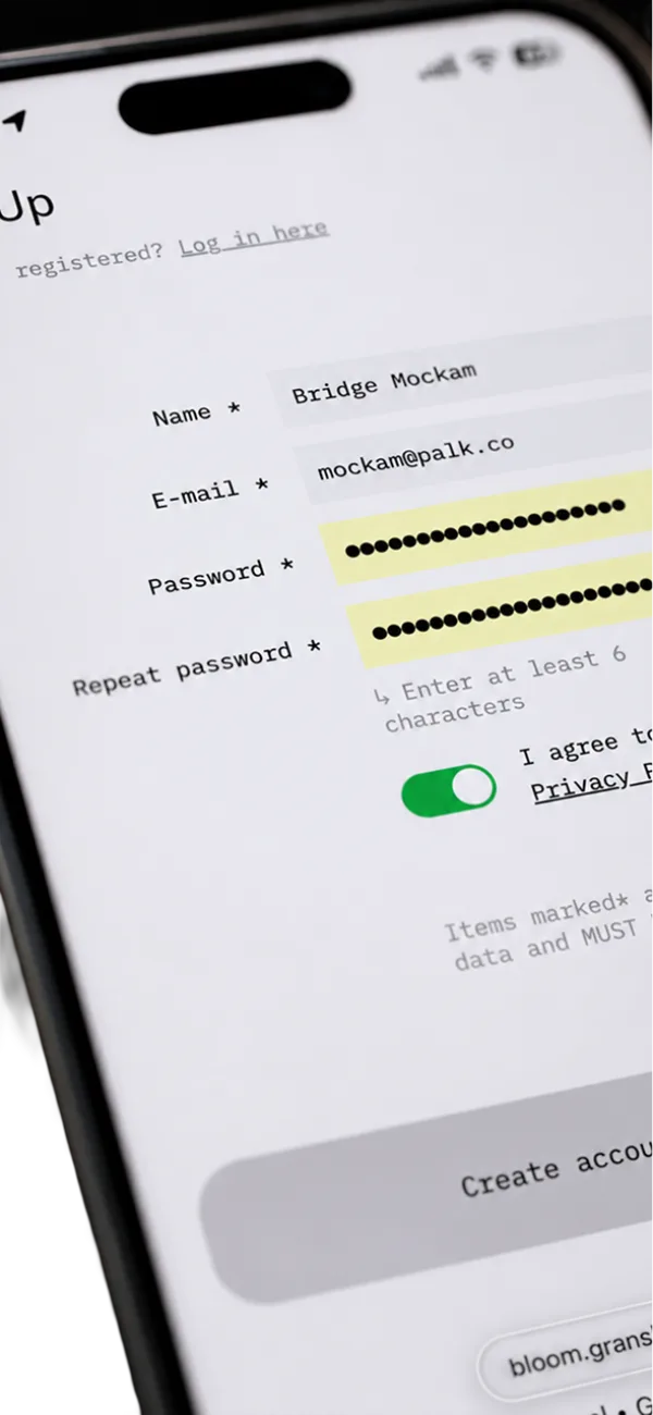 The bloom.granshan.com sign-up form on a phone: name, e-mail, password and repeat password, and the privacy toggle